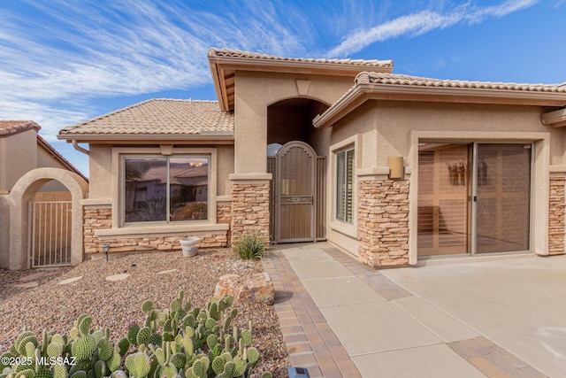 doorway to property featuring a patio