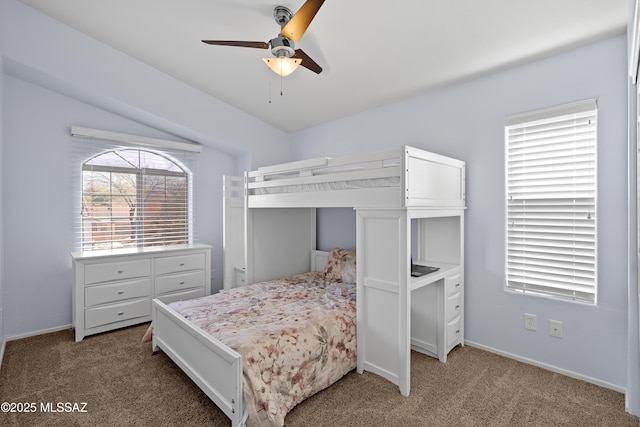 carpeted bedroom with baseboards and a ceiling fan