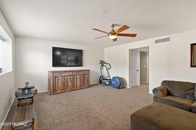 living area with ceiling fan, carpet, visible vents, and baseboards