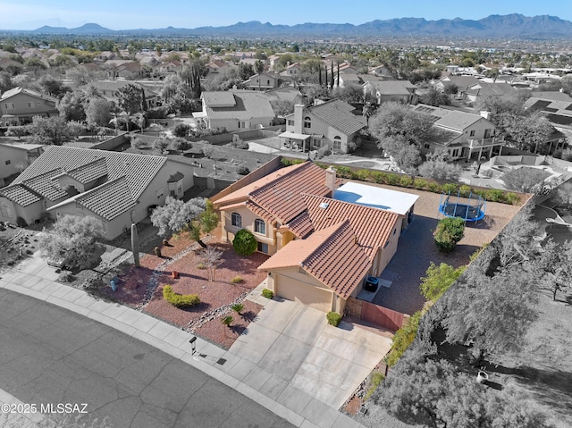 drone / aerial view with a mountain view and a residential view