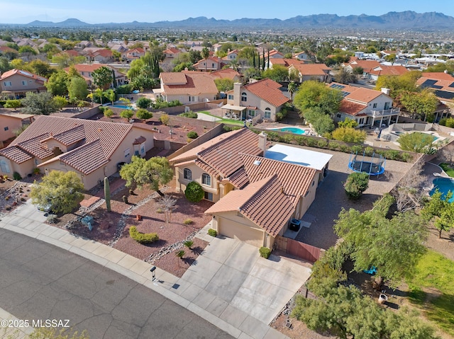 aerial view featuring a mountain view and a residential view