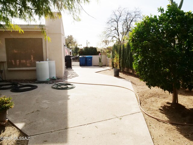 view of patio / terrace featuring a gate and fence