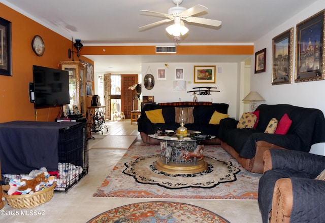 living area with visible vents and a ceiling fan