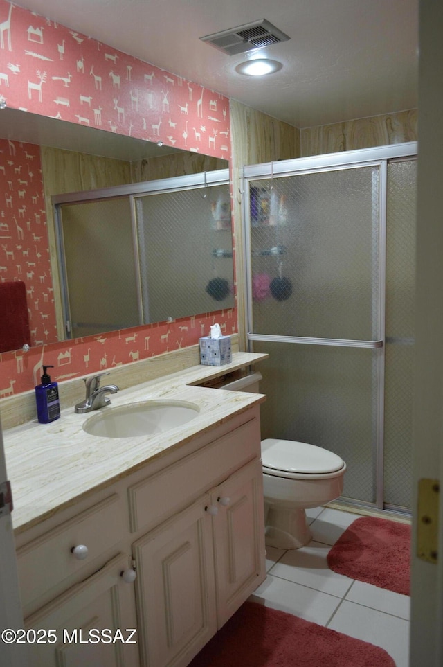 full bath featuring a shower stall, tile patterned floors, visible vents, toilet, and vanity