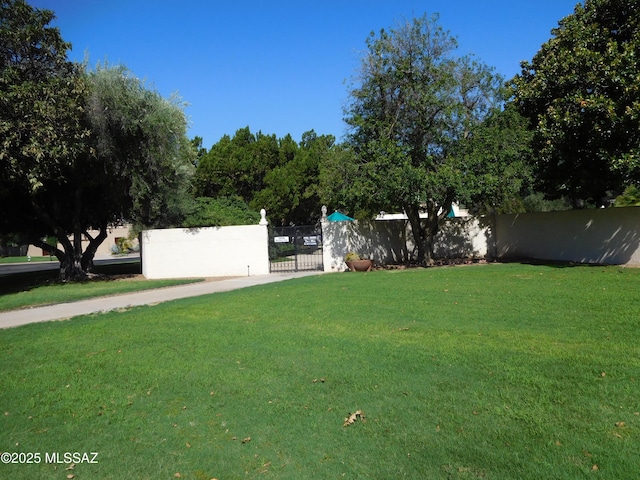 exterior space with a gate and fence private yard