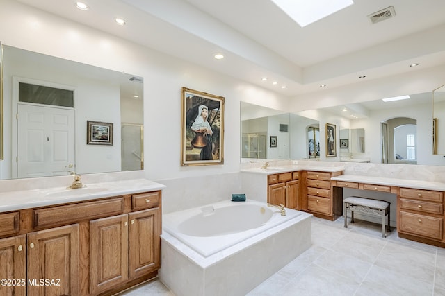 full bath with a skylight, a sink, visible vents, a shower stall, and a bath