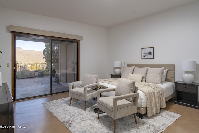 bedroom featuring a mountain view and access to outside