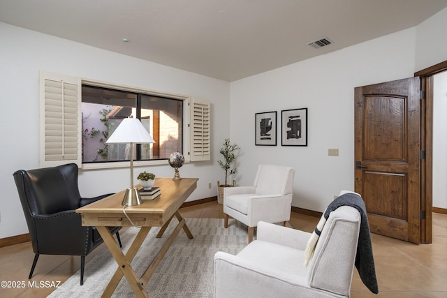 office featuring baseboards and visible vents