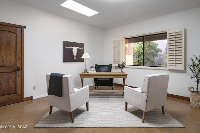 office area with baseboards and concrete floors