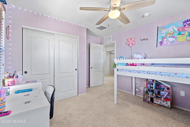 bedroom featuring a ceiling fan, light colored carpet, a closet, and visible vents