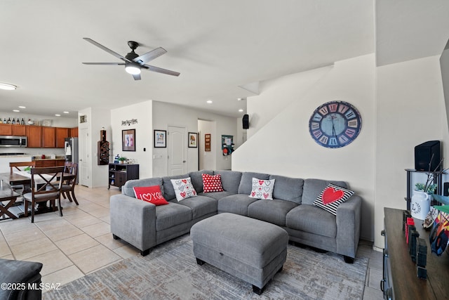 living area with recessed lighting, ceiling fan, and light tile patterned floors