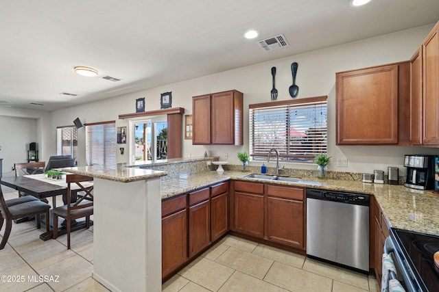 kitchen with a peninsula, a sink, visible vents, electric stove, and stainless steel dishwasher