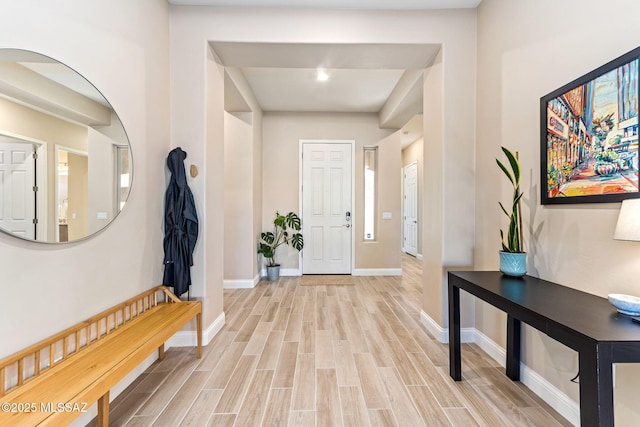 entryway with light hardwood / wood-style floors