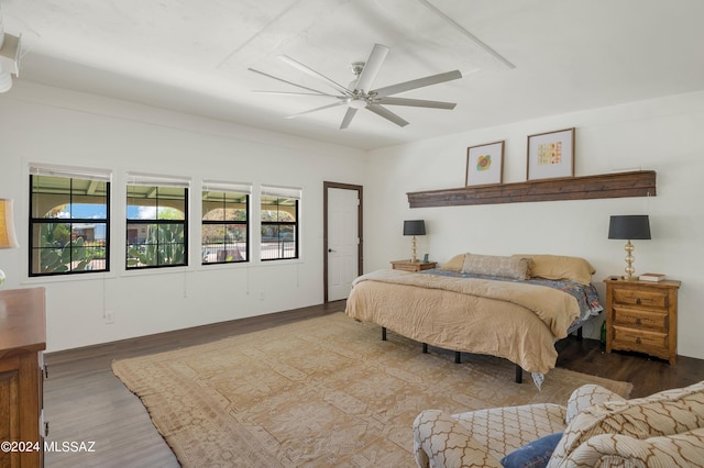 bedroom with ceiling fan and wood finished floors