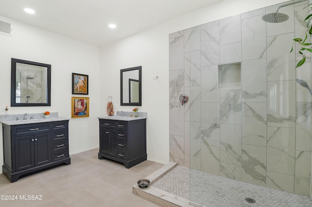 full bath with a walk in shower, recessed lighting, two vanities, a sink, and baseboards