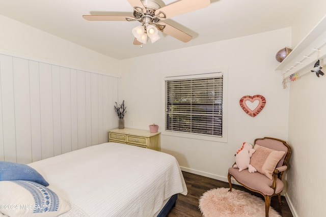 bedroom featuring dark wood-type flooring, ceiling fan, and baseboards