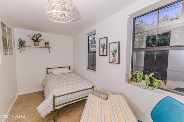 bedroom featuring baseboards