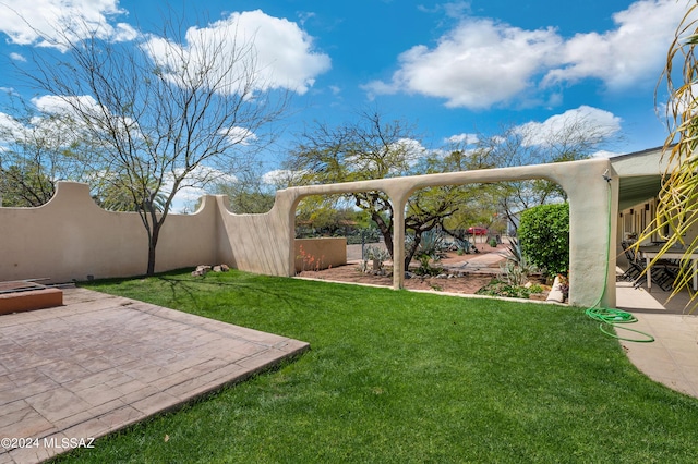 view of yard with a patio area and fence