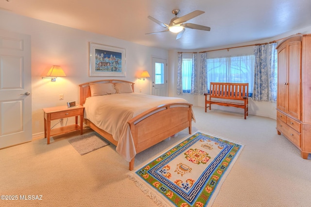 bedroom with baseboards, light carpet, and a ceiling fan