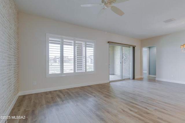 spare room with light hardwood / wood-style flooring and ceiling fan