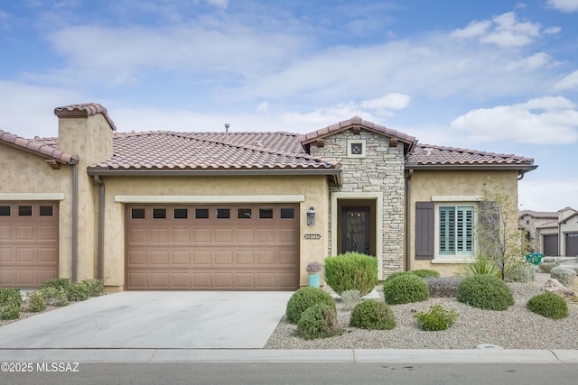 mediterranean / spanish house with a garage