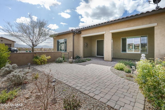 back of property with a patio area