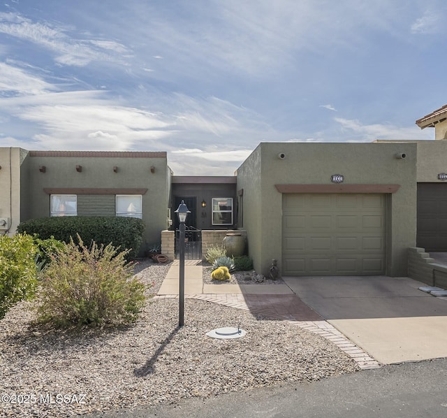 southwest-style home featuring a garage