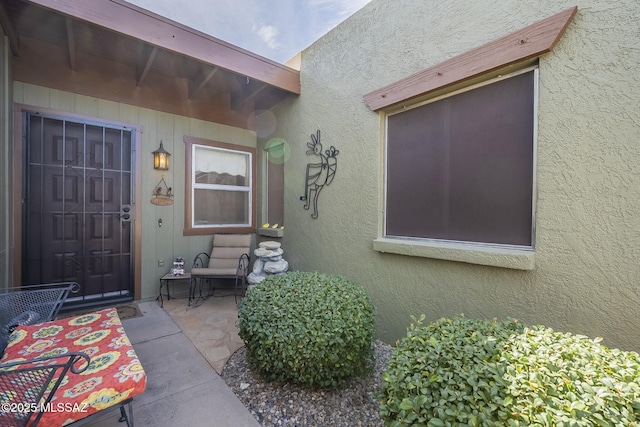 property entrance with a patio area