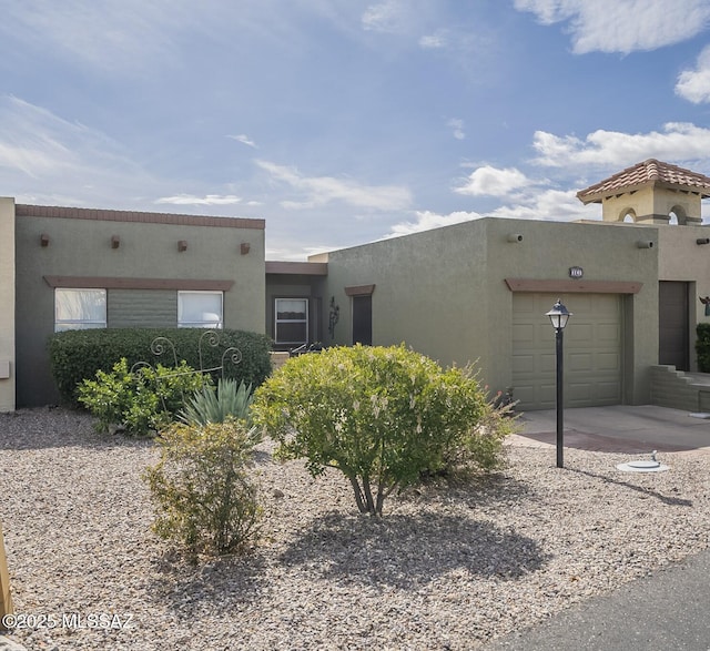 southwest-style home featuring a garage