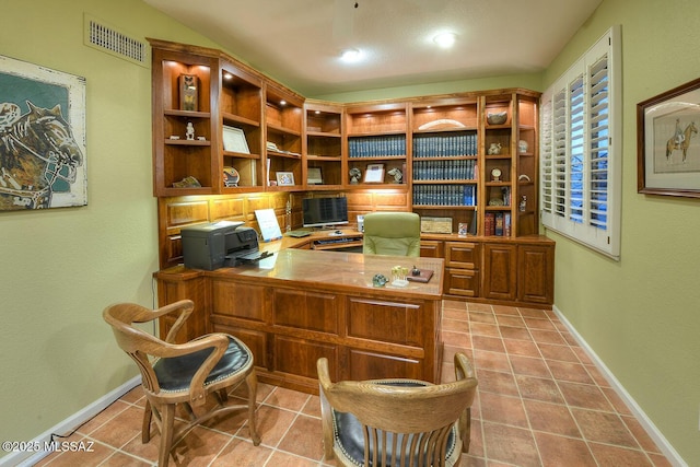 office area with light tile patterned floors, visible vents, and baseboards