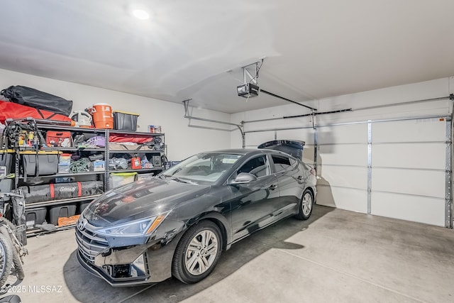 garage featuring a garage door opener