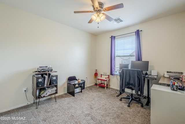 carpeted office with ceiling fan