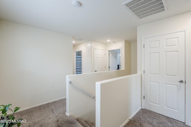 corridor featuring carpet flooring