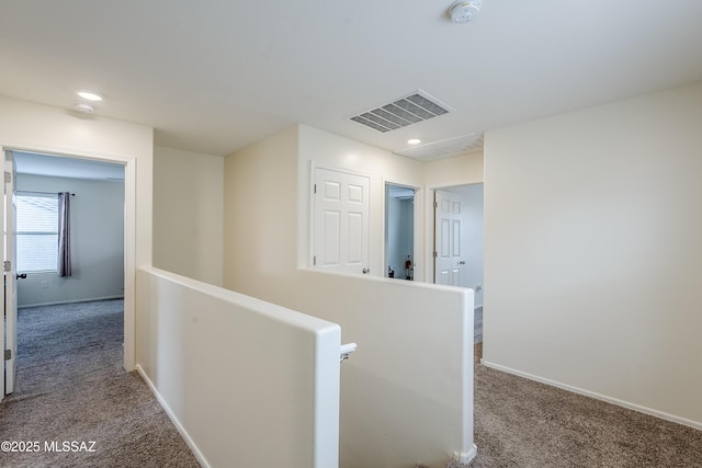 corridor with carpet flooring