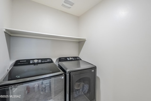 laundry room with washing machine and dryer