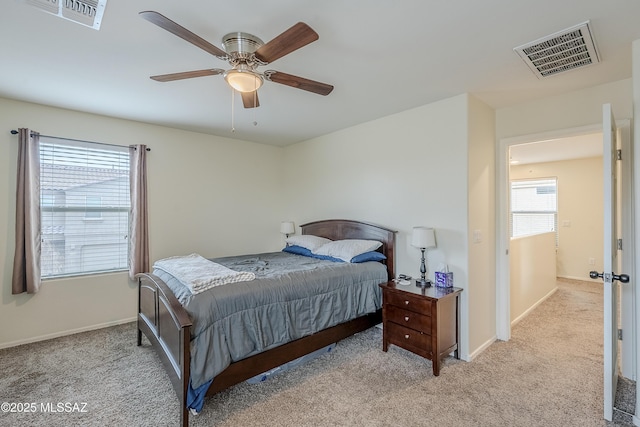 bedroom with light carpet and ceiling fan