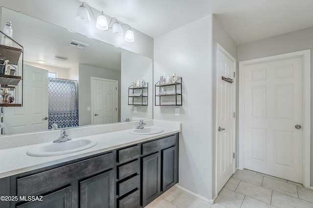 bathroom with vanity and tile patterned floors