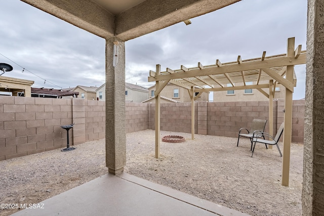 view of patio / terrace with a pergola and an outdoor fire pit