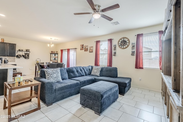 tiled living room featuring ceiling fan