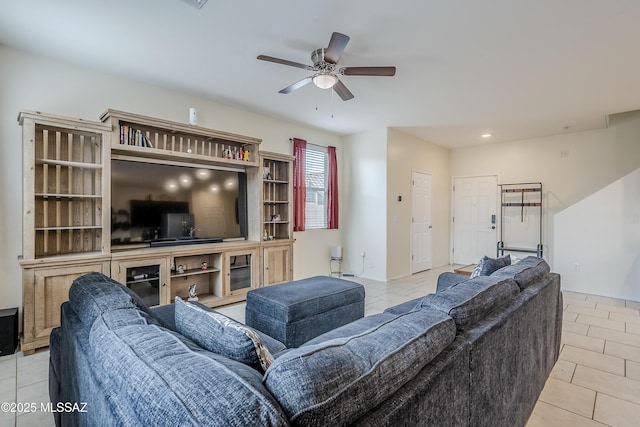 tiled living room with ceiling fan