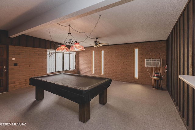 playroom with a textured ceiling, brick wall, carpet floors, billiards, and beamed ceiling