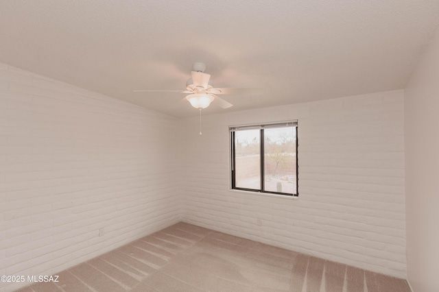 empty room with light carpet and ceiling fan