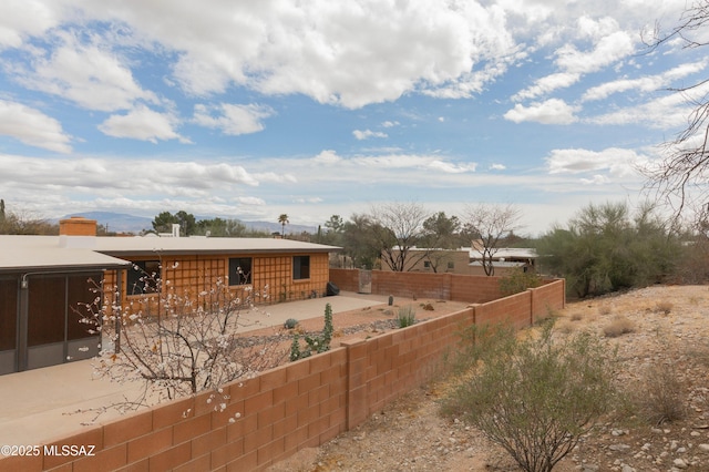 view of yard with fence and a patio