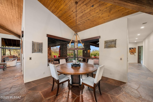 dining space featuring high vaulted ceiling, wooden ceiling, and plenty of natural light