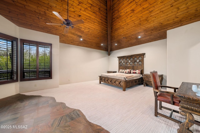 bedroom with a high ceiling, carpet, and wooden ceiling