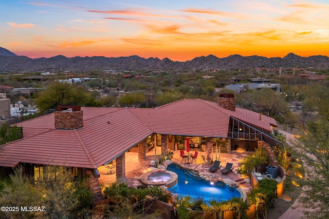 aerial view at dusk with a mountain view