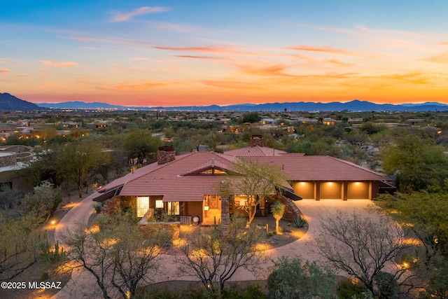 view of front of house featuring a mountain view and a garage