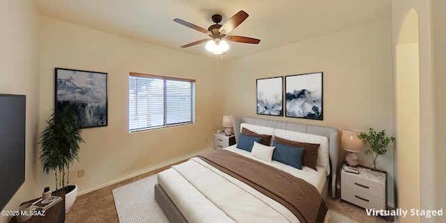 carpeted bedroom featuring ceiling fan