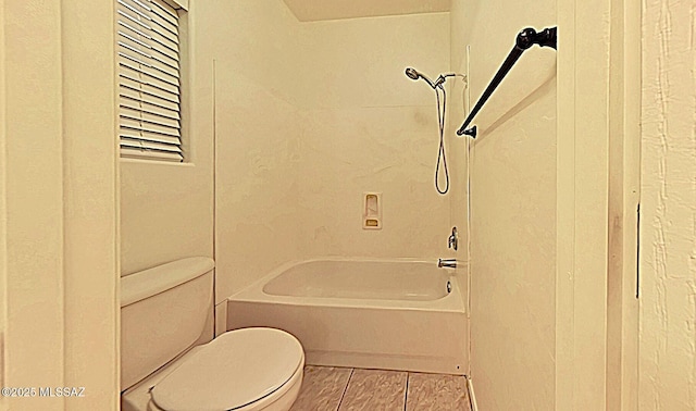 bathroom with shower / bathtub combination and toilet