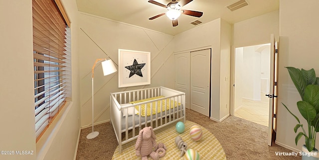 bedroom featuring a closet, ceiling fan, and carpet